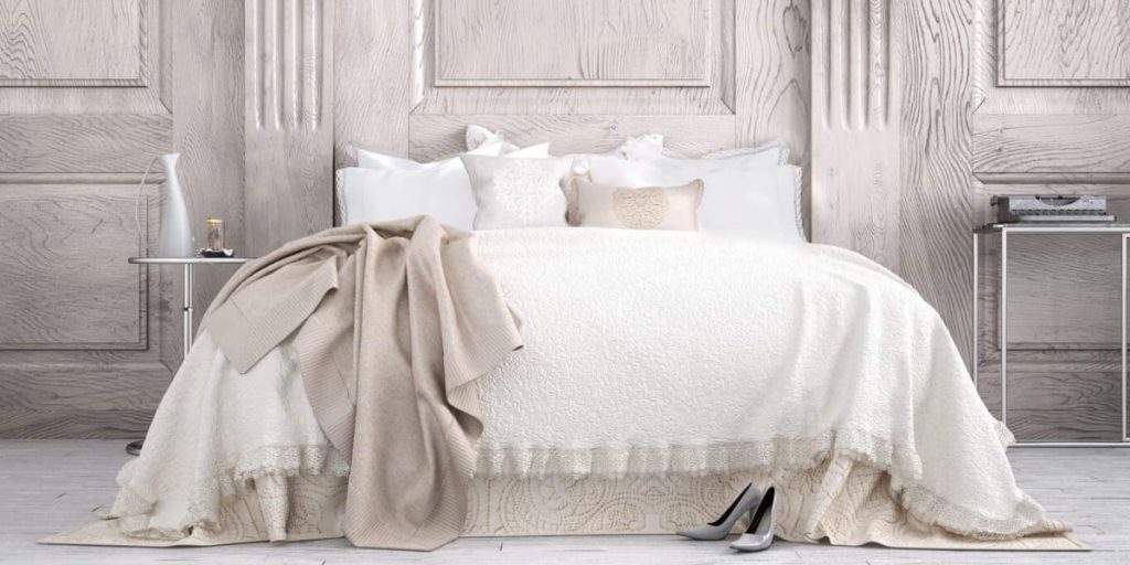 bed with white bed skirt