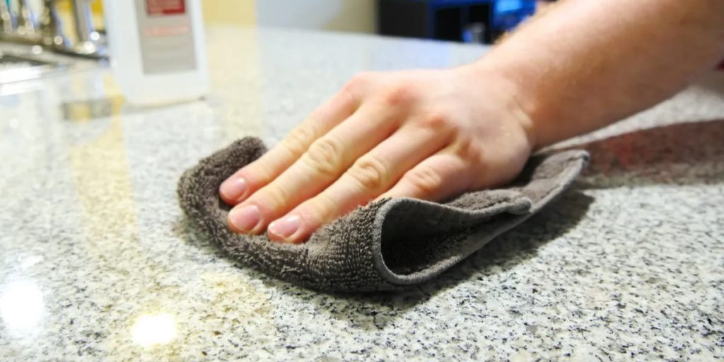 wiping granite countertop