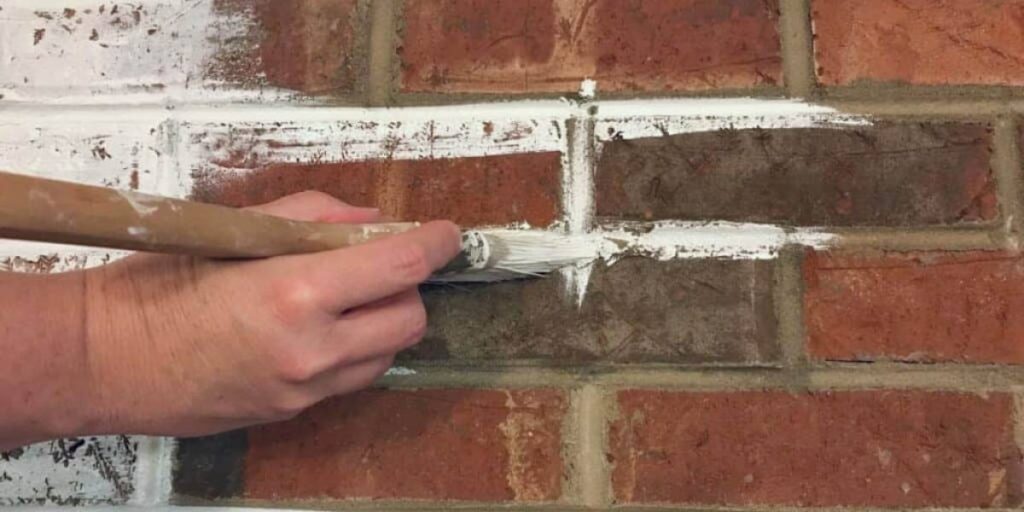 putting primary paint layer on brick surface