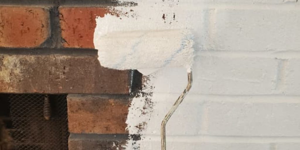 painting fireplace with white paint