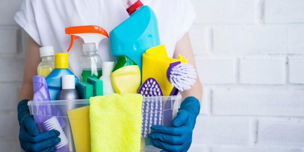 holding cleaning supplies