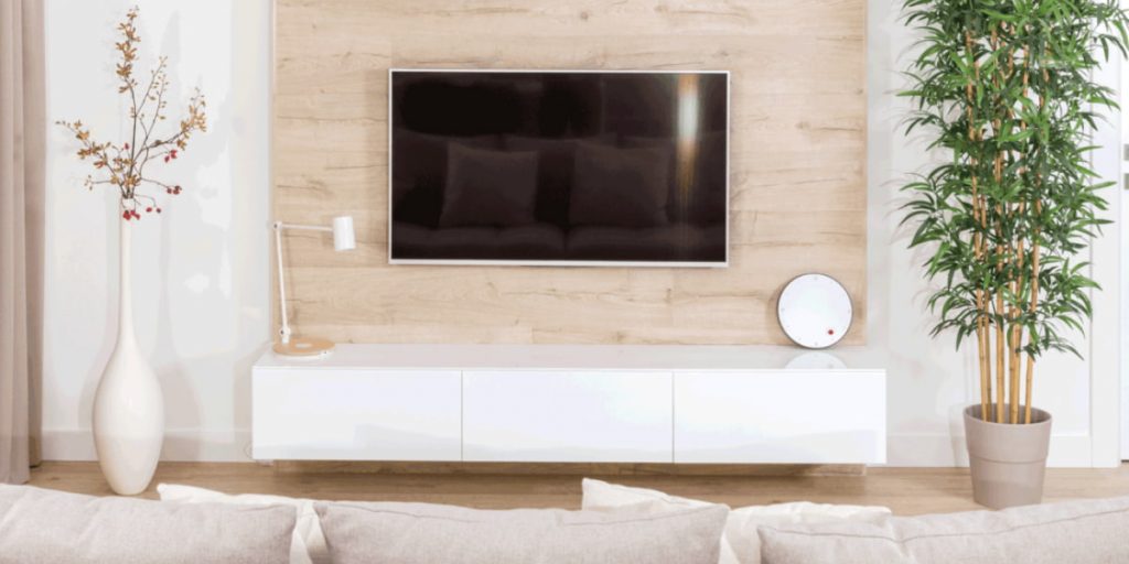 space around TV decorated with wall frame