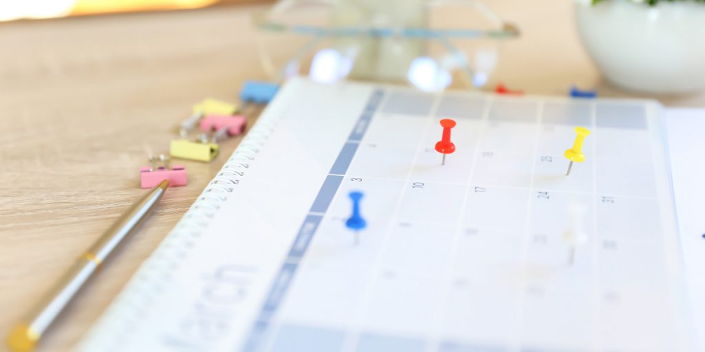 calendar with pins paper organization idea