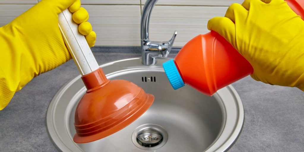cleaning a sink drain with a plunger