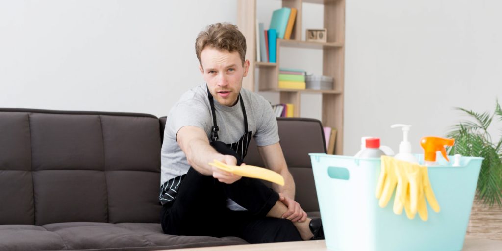 man is handing cleaning cloth