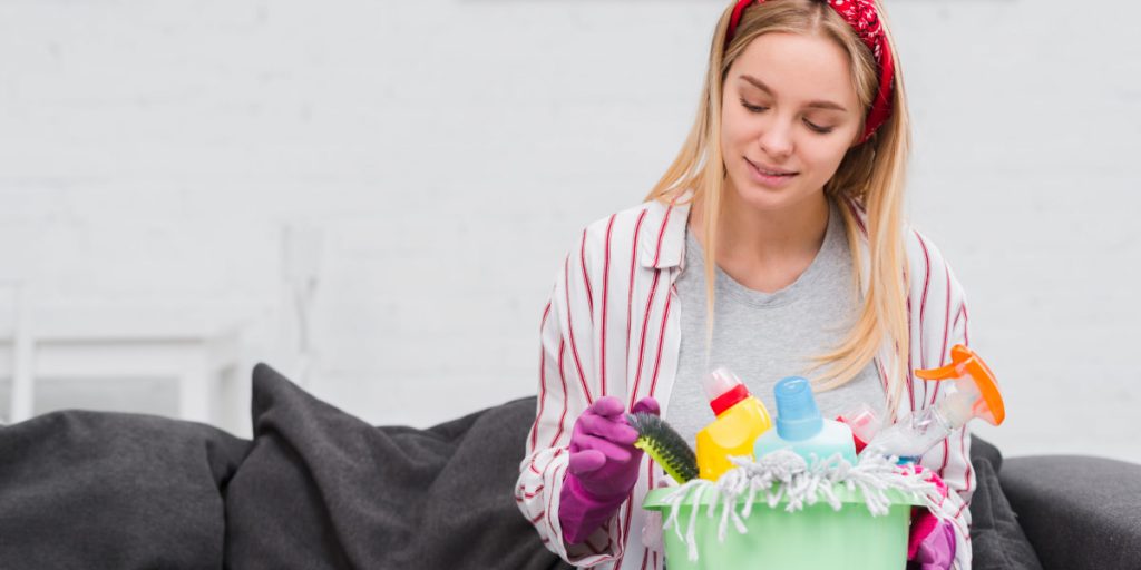 girl is picking a cleaning equipment