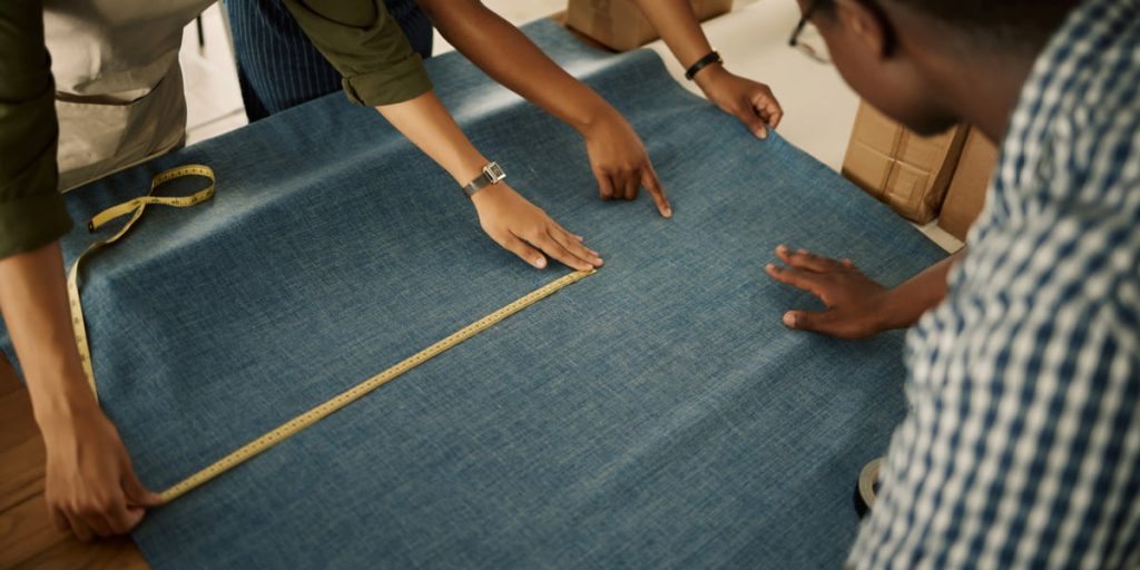 measuring the fabric for curtain