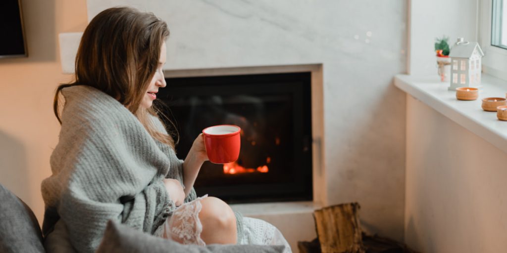 woman with cup of hot drink