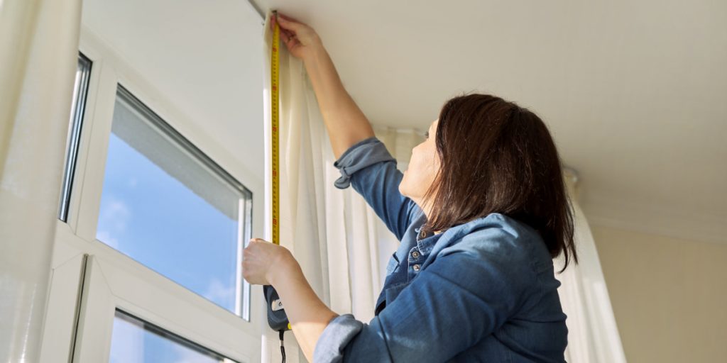 woman measure window