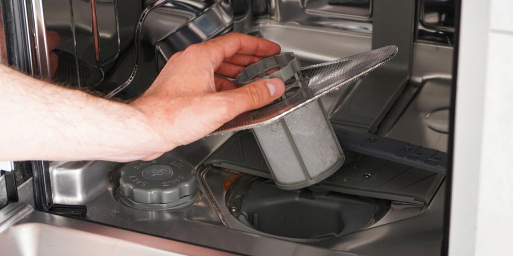 man drain dishwasher water