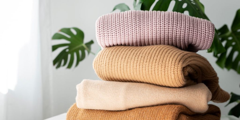 folded sweaters for storing