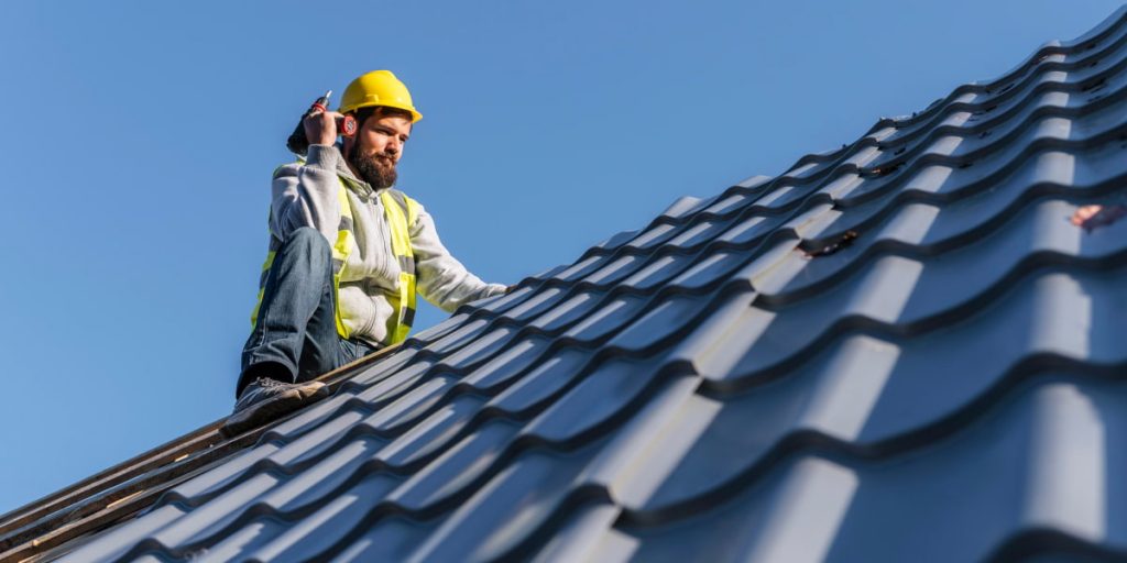 craftman installing shingles