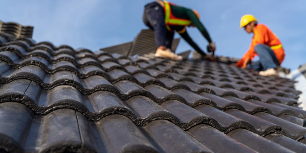 laying shingles on a roof