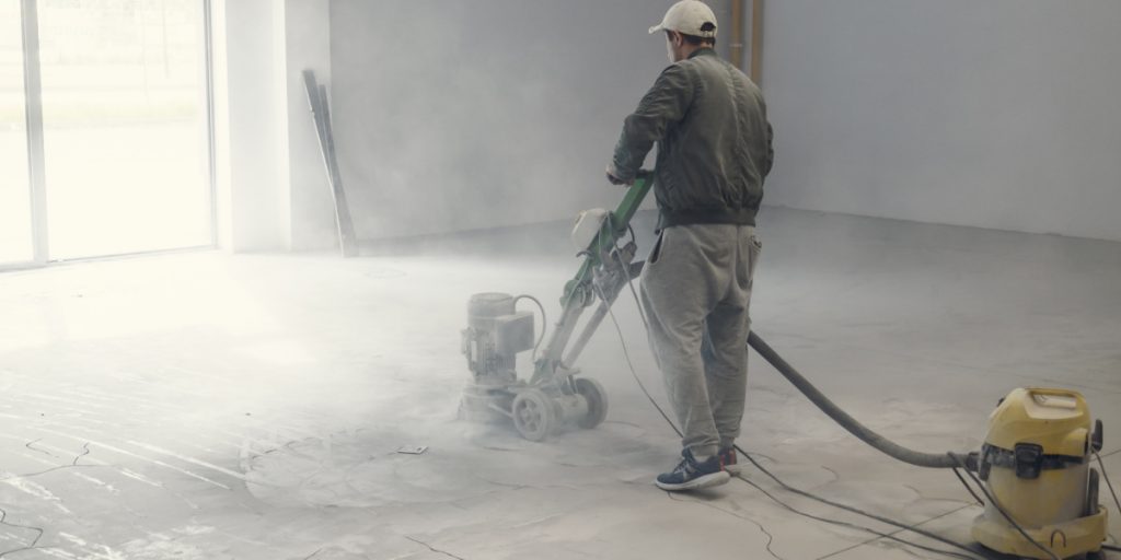man finish a concrete floor